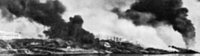 На фотографии через дым виден горящий Сталинград. Скорее всего фото сделано с противоположного...